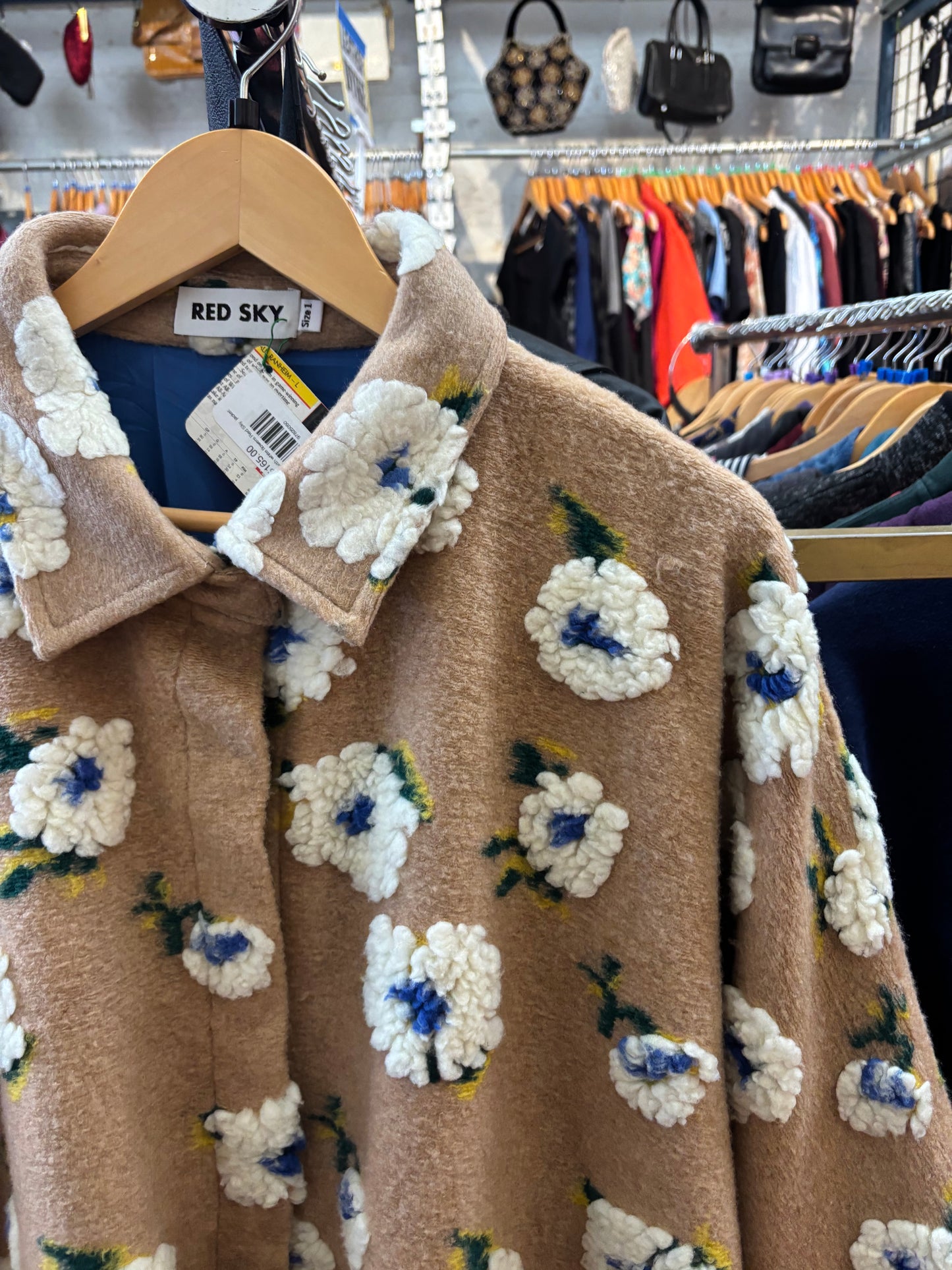 size 1 puffy sand with white flowers Red Sky jacket